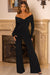 Hand On Heart | Schwarzer Jumpsuit mit Twist-Front und Bardot-Ausschnitt sowie langen Ärmeln.