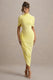 Enchant | Zitronengelbes Midikleid mit asymmetrischem Twist und Cape