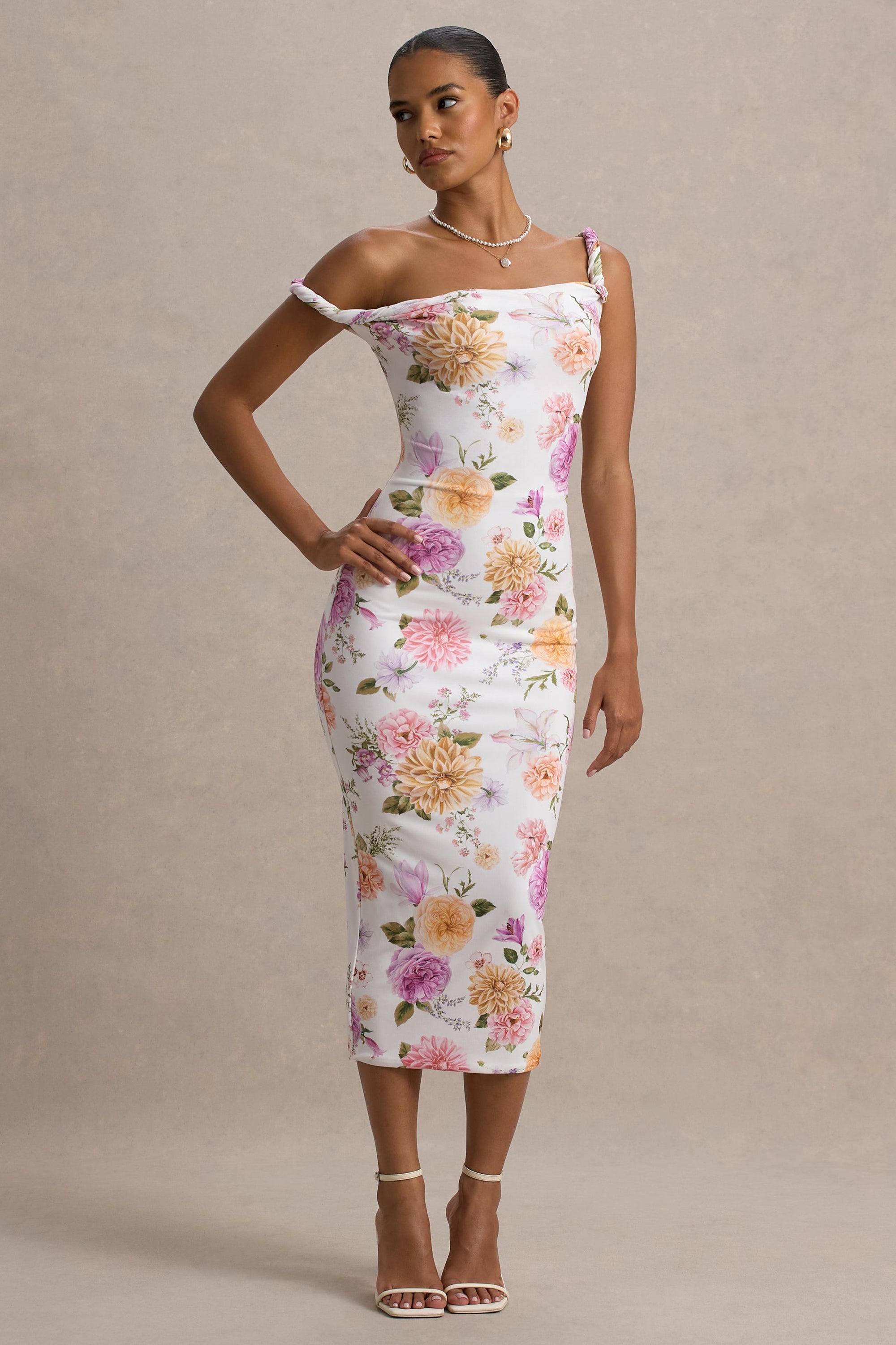 Nora | Pfirsich- und fliederfarbenes Midikleid mit Blumenprint und asymmetrischem Ausschnitt