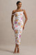Nora | Pfirsich- und fliederfarbenes Midikleid mit Blumenprint und asymmetrischem Ausschnitt