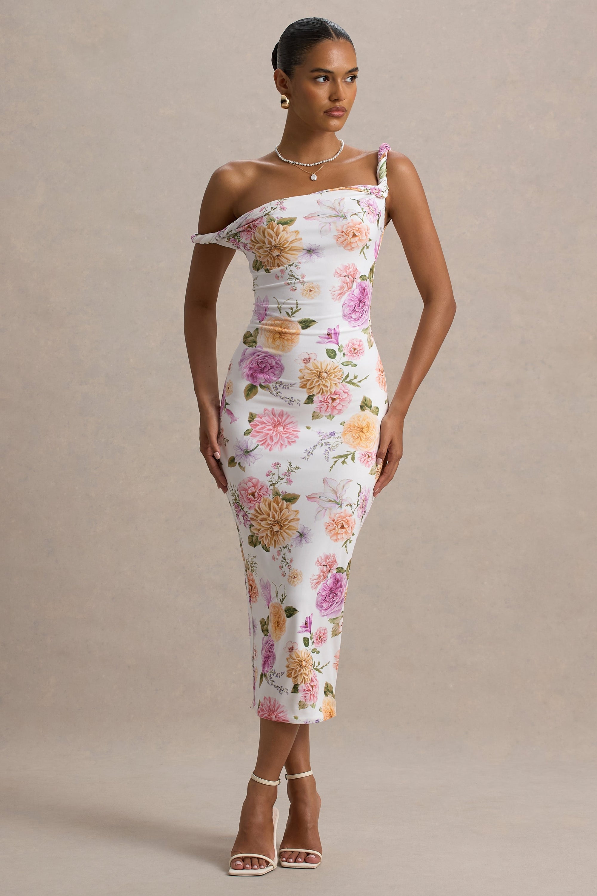 Nora | Pfirsich- und fliederfarbenes Midikleid mit Blumenprint und asymmetrischem Ausschnitt